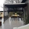 Pergola Bioclimatique Alu Anthracite 10,80m² Toit Avec Lames Ovales Alu + 5 Panneaux Moucharabieh + 1 Rideau Gris – HABRITA -Abri De Jardin pergola bioclimatique alu anthracite 1080m toit avec lames ovales alu 5 panneaux moucharabieh 1 rideau gris habrita